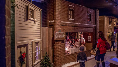 Visitors looking at a display in Dickens Village