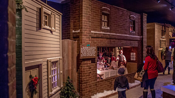 Visitors looking at a display in Dickens Village